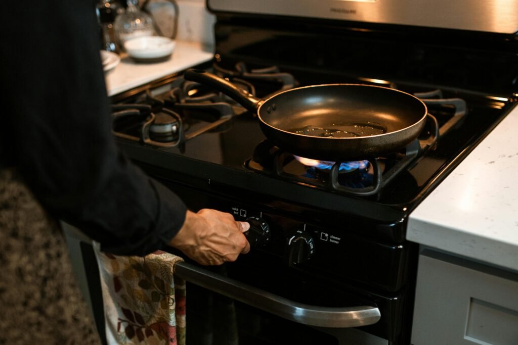 Modern portable gas stove indoor on a kitchen counter, ideal for compact kitchens, emergency cooking, and flexible daily use with butane canisters.