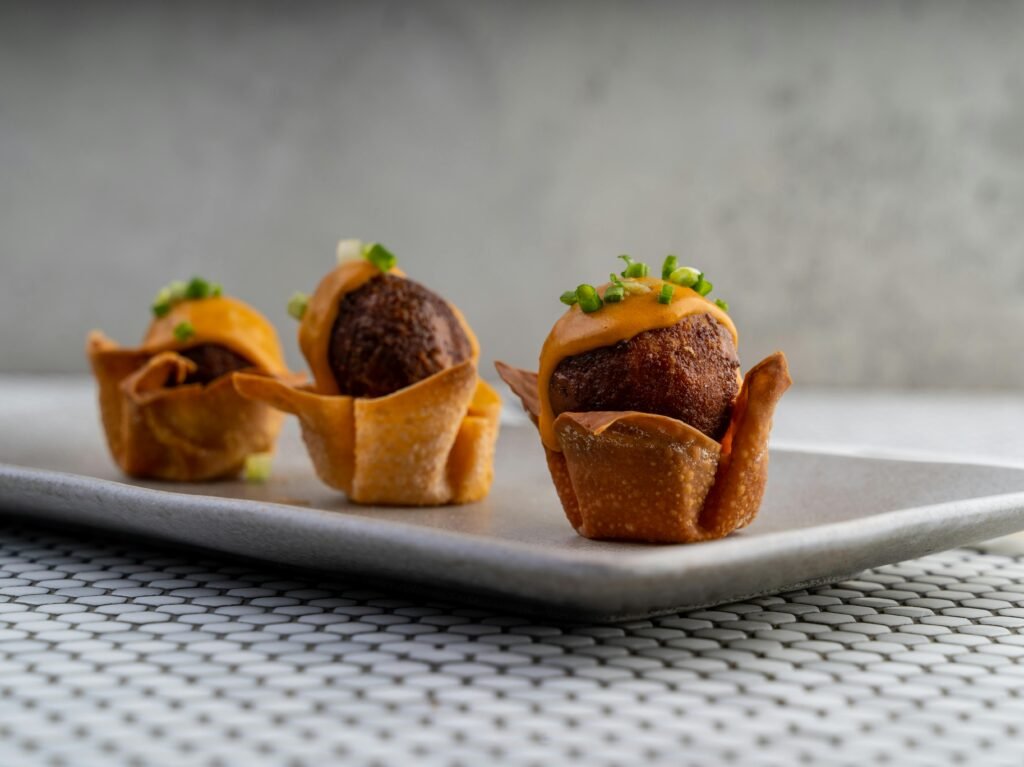 The new 2025 Ninja air fryer sits on a modern kitchen counter, with a basket pulled out to reveal perfectly golden-brown crispy food.