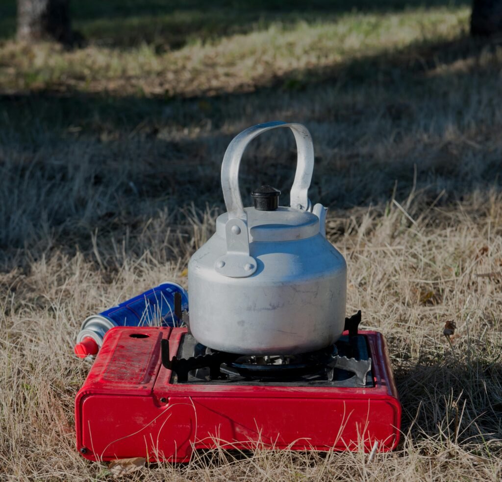 Portable single burner gas stove used for cooking outdoors on a camping trip or during an emergency.
